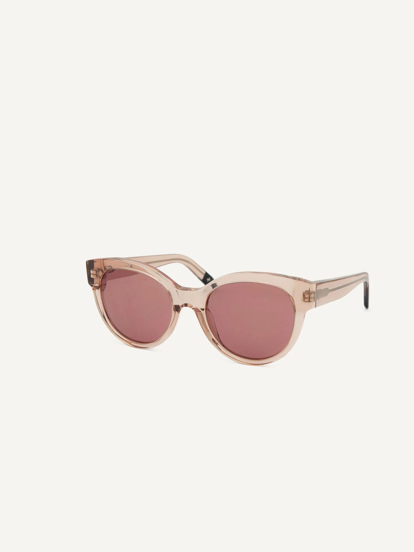 A pair of Paris Sunglasses – Pale Rose by Dick Moby on a white background.