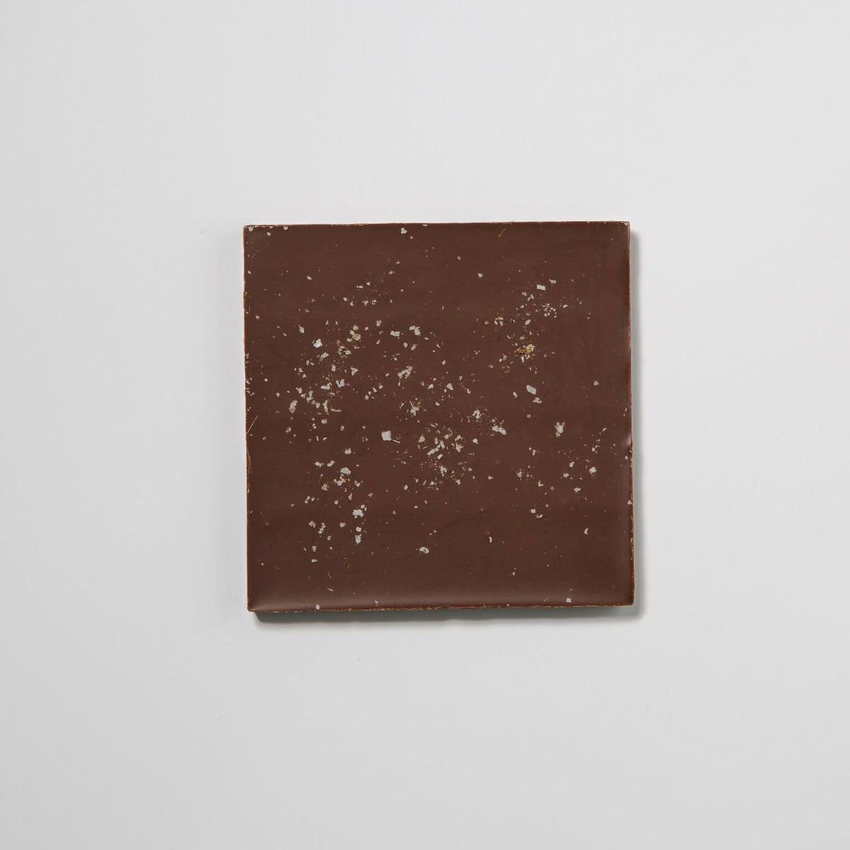 A square Almond Butter Chocolate Bar with sprinkles, made by Flint Chocolate.