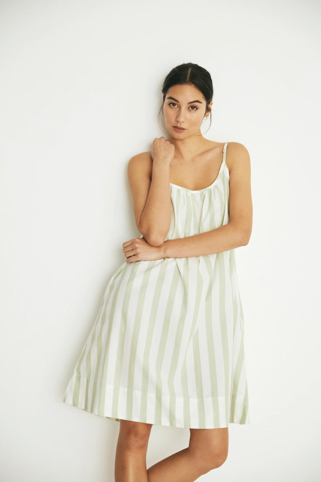 A model wearing the Evie Slip - Pear Stripe slip dress by general sleep.