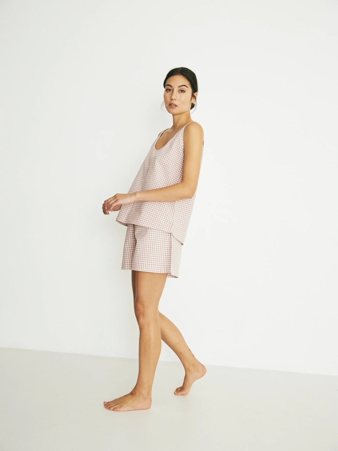 The model is wearing a Summer Set - Rose Gingham pajama set by general sleep.