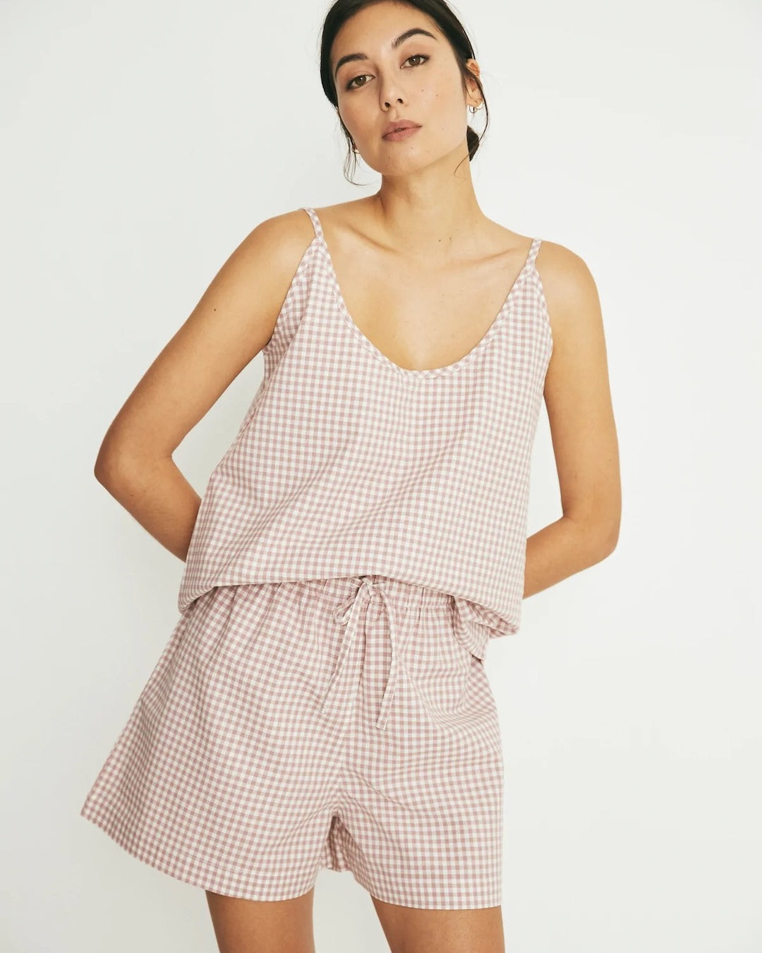 The model is wearing a Summer Set - Rose Gingham romper by general sleep.