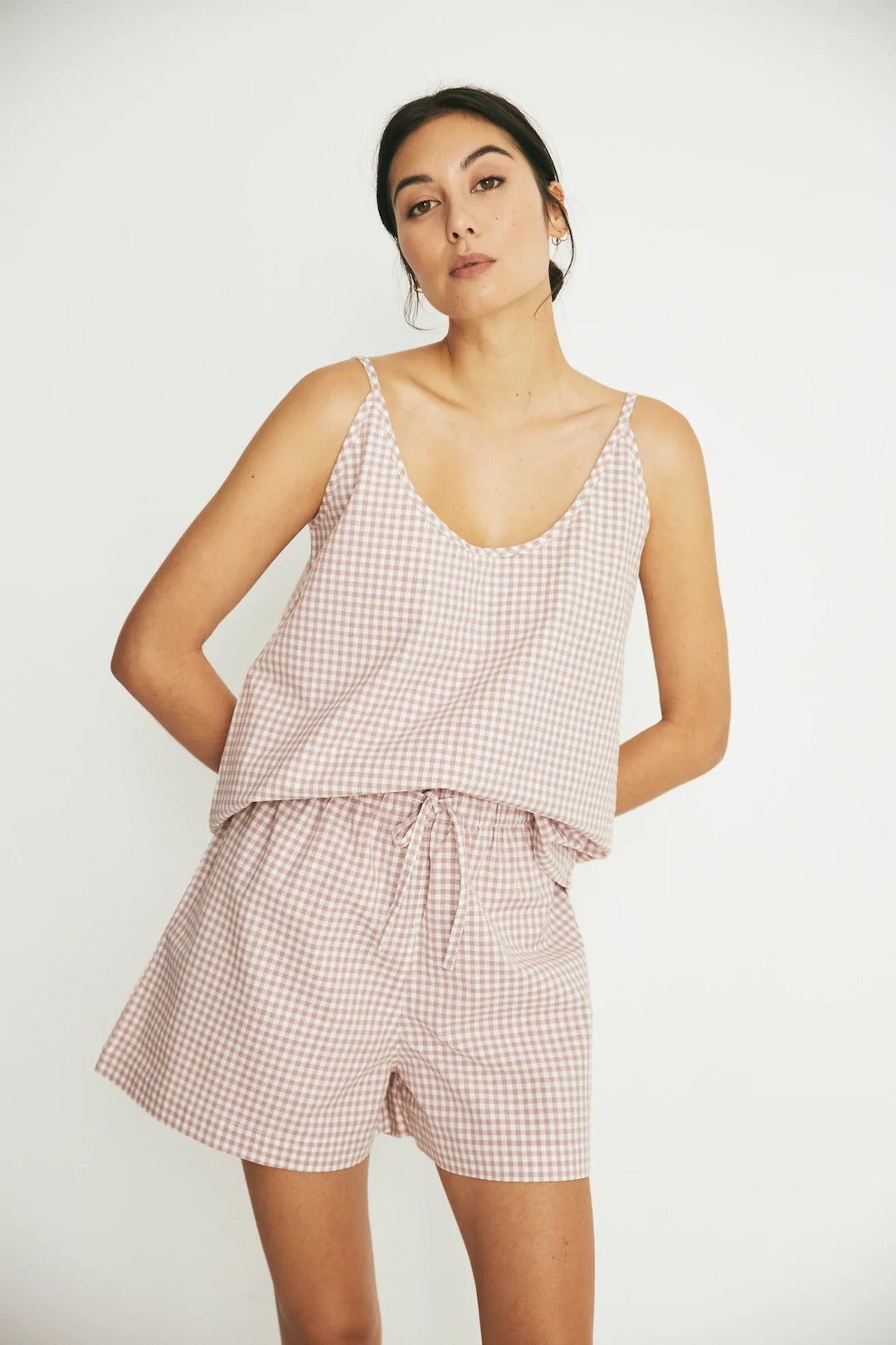 The model is wearing a Summer Set - Rose Gingham romper by general sleep.