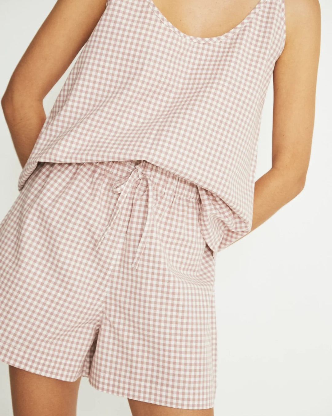 The model is wearing a Summer Set - Rose Gingham pyjama set by general sleep.