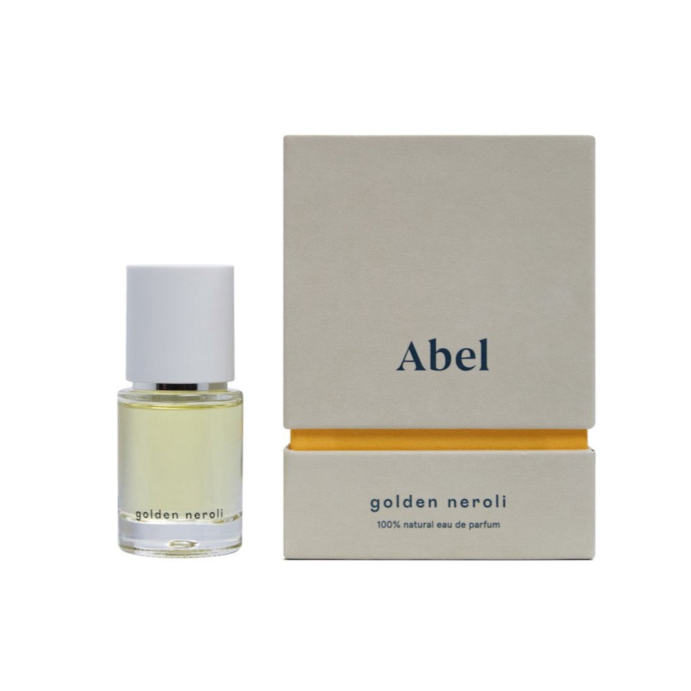 A bottle of &#39;Golden Neroli&#39; vegan natural eau de parfum by Abel with its packaging.