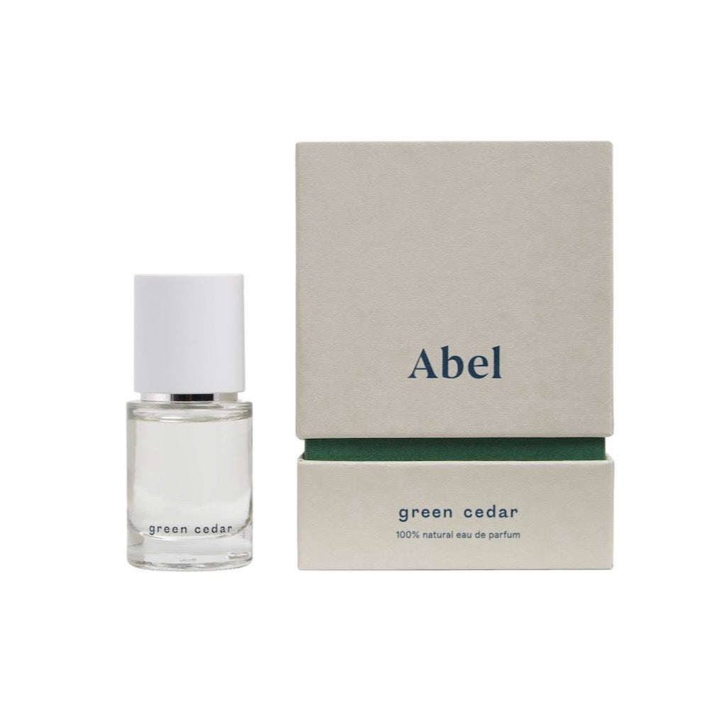 A bottle of Green Cedar – velvety, rich wood by Abel with an intoxicating fragrance.