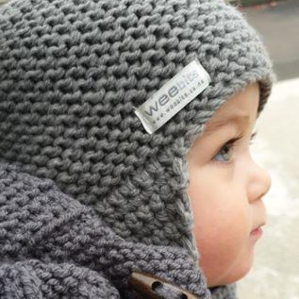 A baby wearing a grey Weebits Hand Knitted Chunky Knit Hat - Mushroom hat.