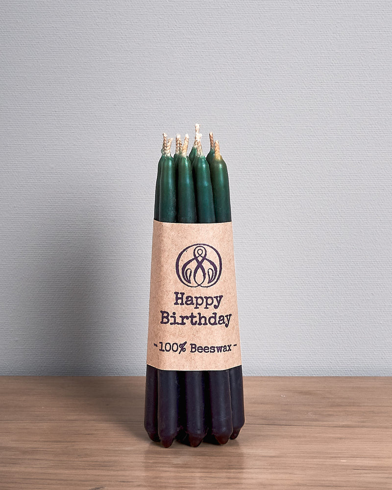 Hohepa Candles Happy Birthday Candles Set – Green, Blue & Purple on a wooden table.