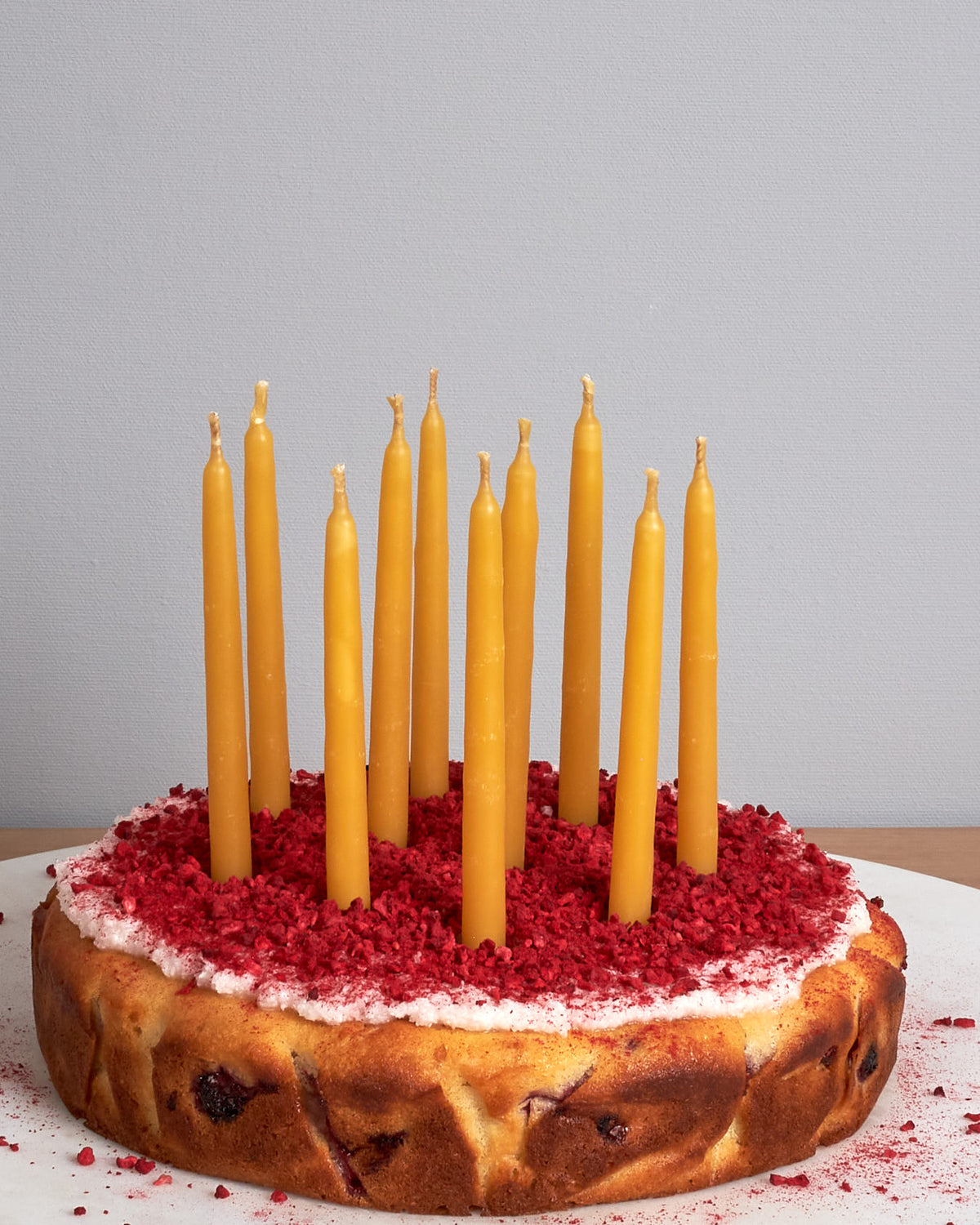 A cake with Hohepa Candles' Birthday Candles Set – Natural on top of it.
