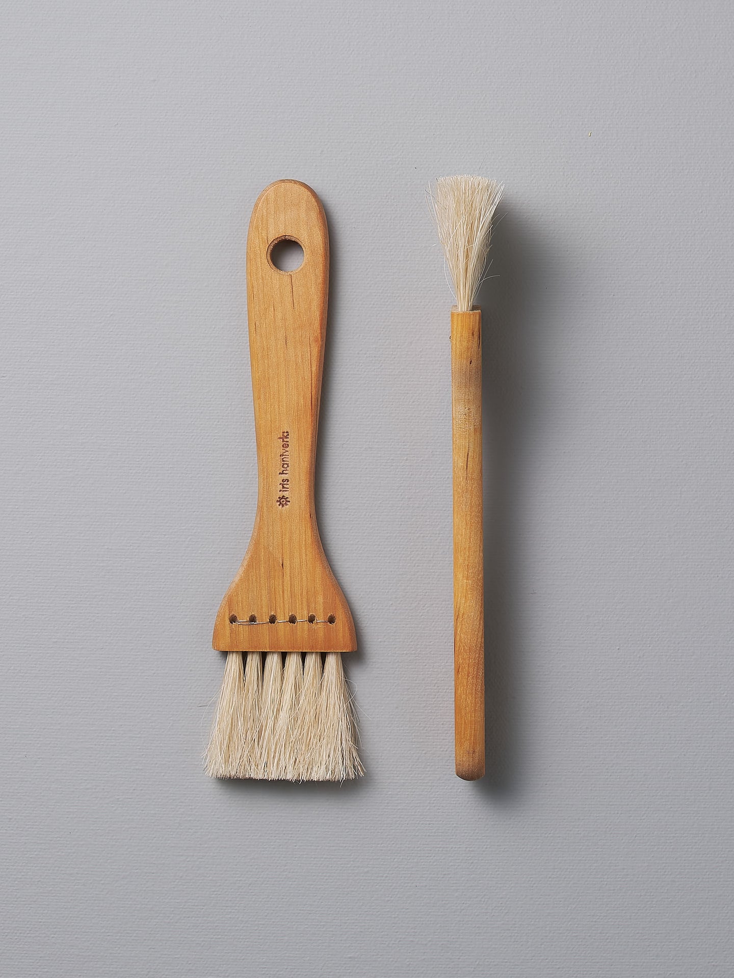 A Pastry Brush – Waxed Birch & Horsehair and a Pastry Brush – Waxed Birch & Horsehair next to each other (brand: Iris Hantverk).