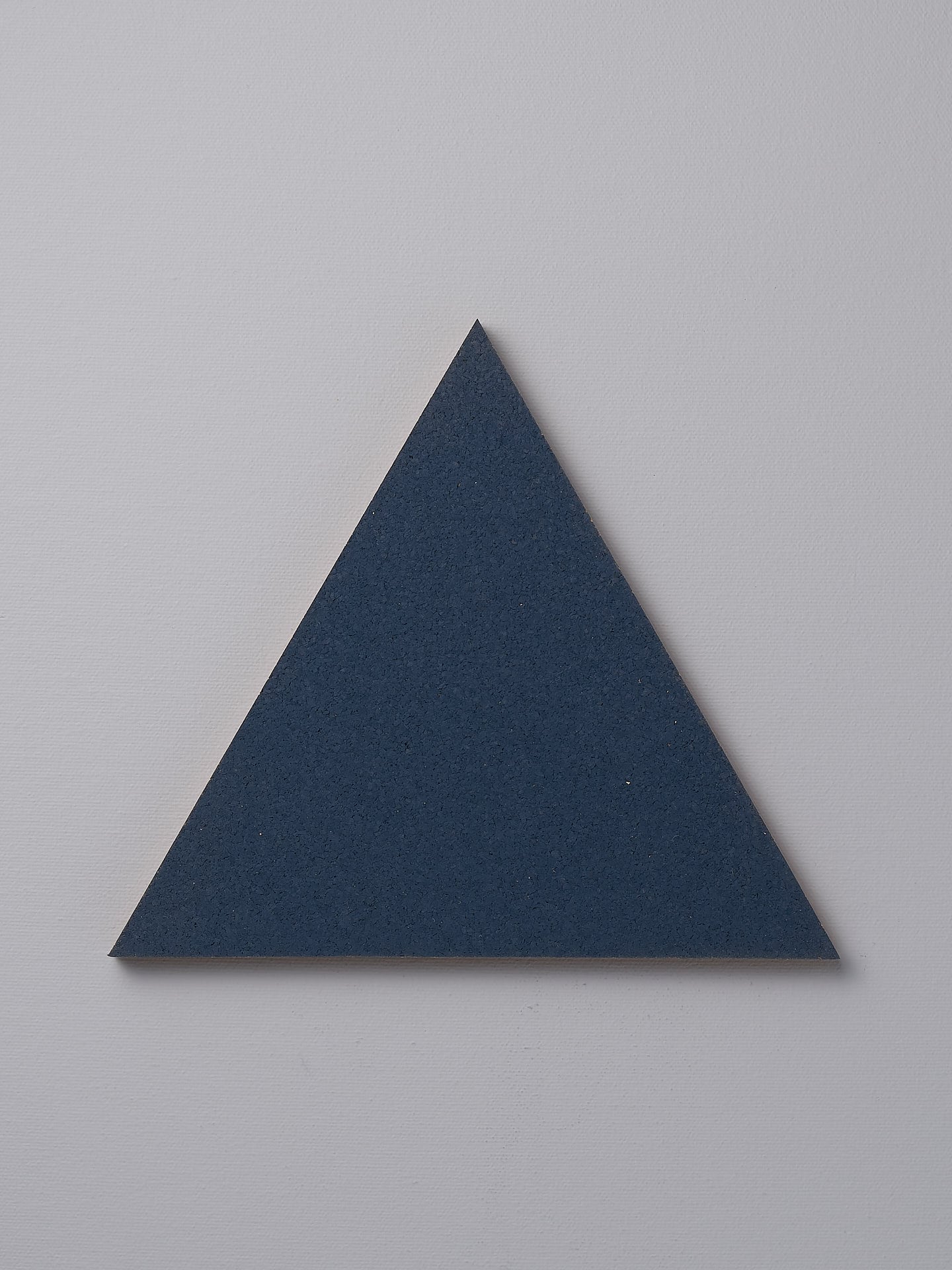 An Iris Hantverk Orion Blue trivet on a white background.