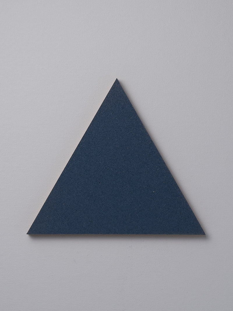 An Iris Hantverk Orion Blue trivet on a white background.
