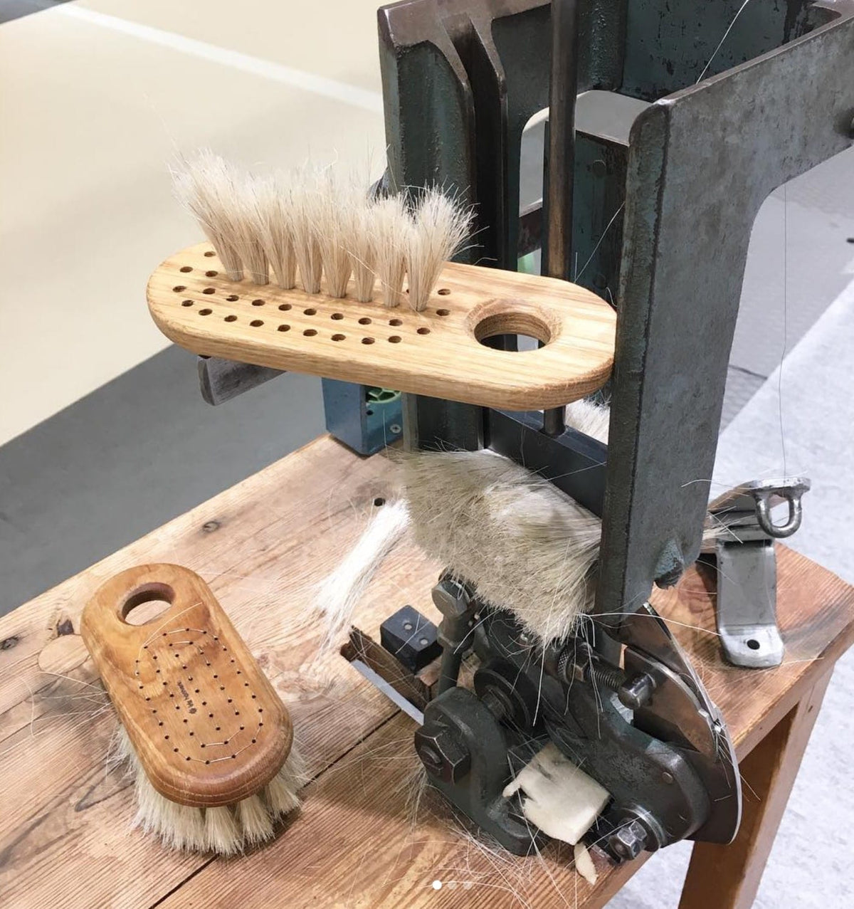 A machine with a Body Brush – Firm by Iris Hantverk on top of it.