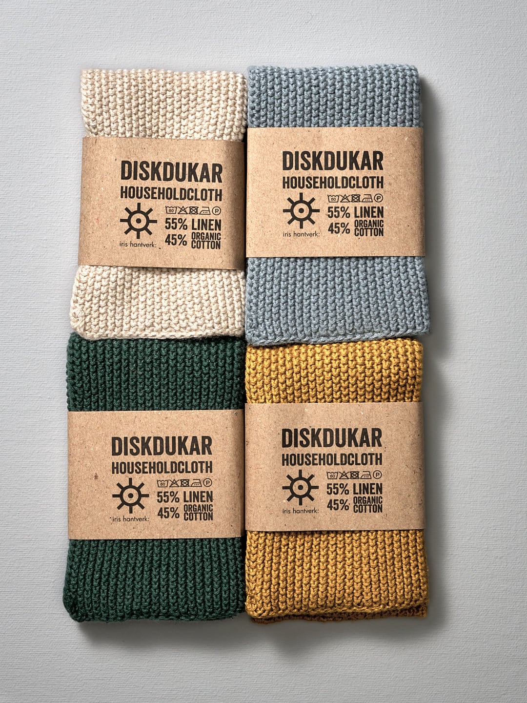 A set of four Iris Hantverk Linen Household Cloth – Four Colours with labels on them for use as household cloth.