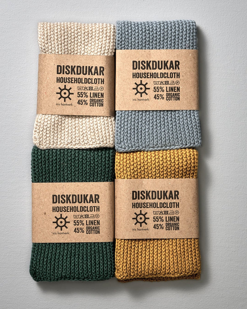 A set of four Iris Hantverk Linen Household Cloth – Four Colours with labels on them for use as household cloth.