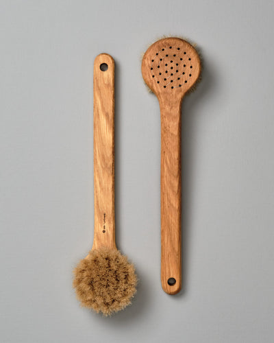 Two Iris Hantverk Body Brushes – Round Head on a grey background.