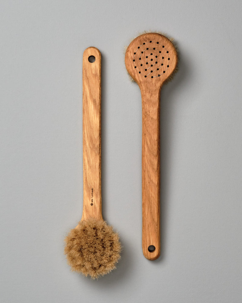 Two Iris Hantverk Body Brushes – Round Head on a grey background.