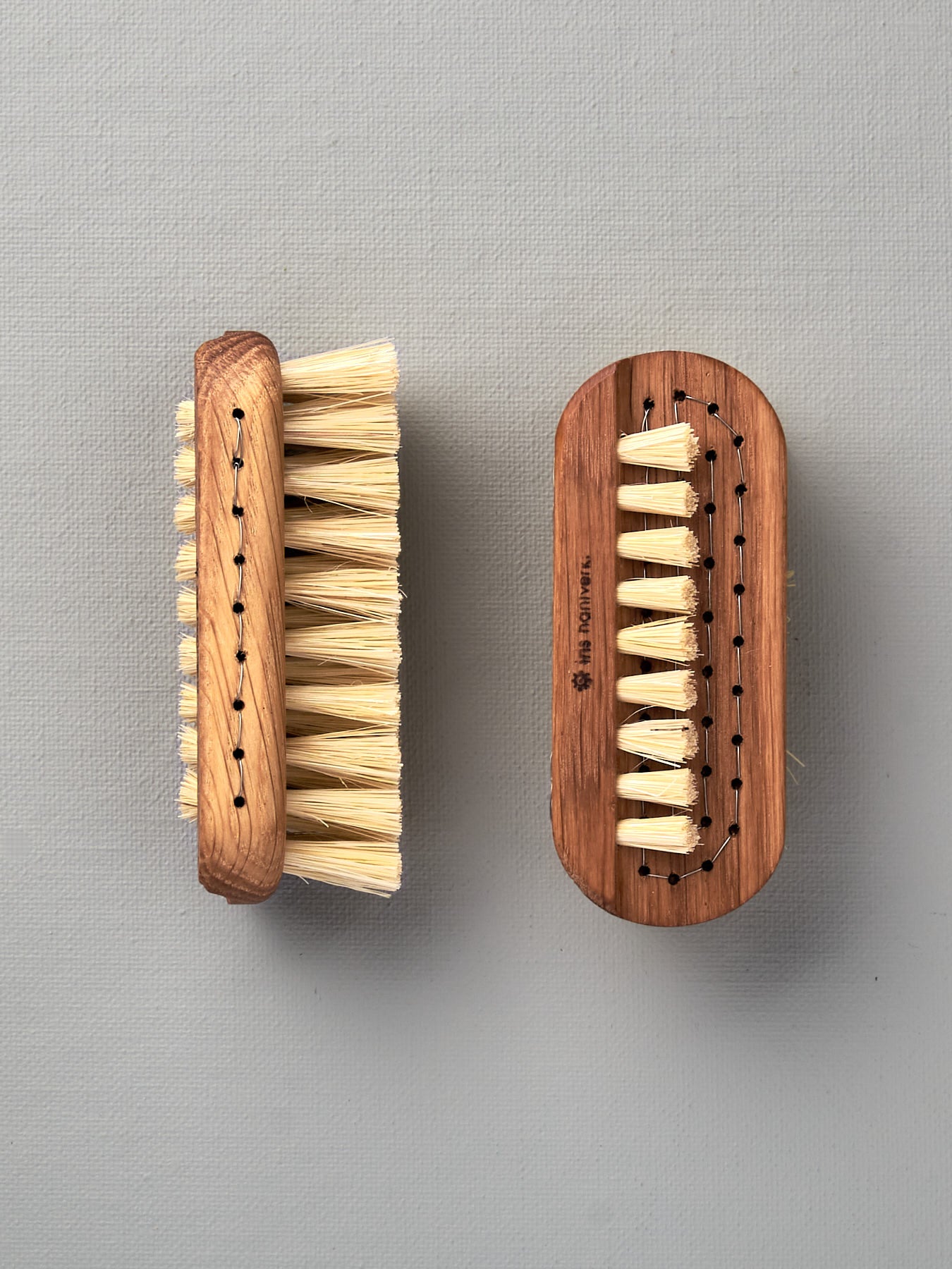 Two Iris Hantverk Nail Brush – Large on a white surface.