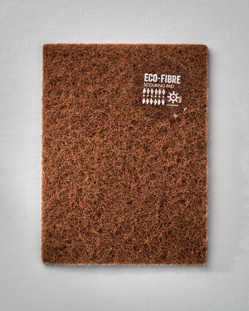 A brown Eco-Fibre Scouring Pad with the brand name Iris Hantverk on it.