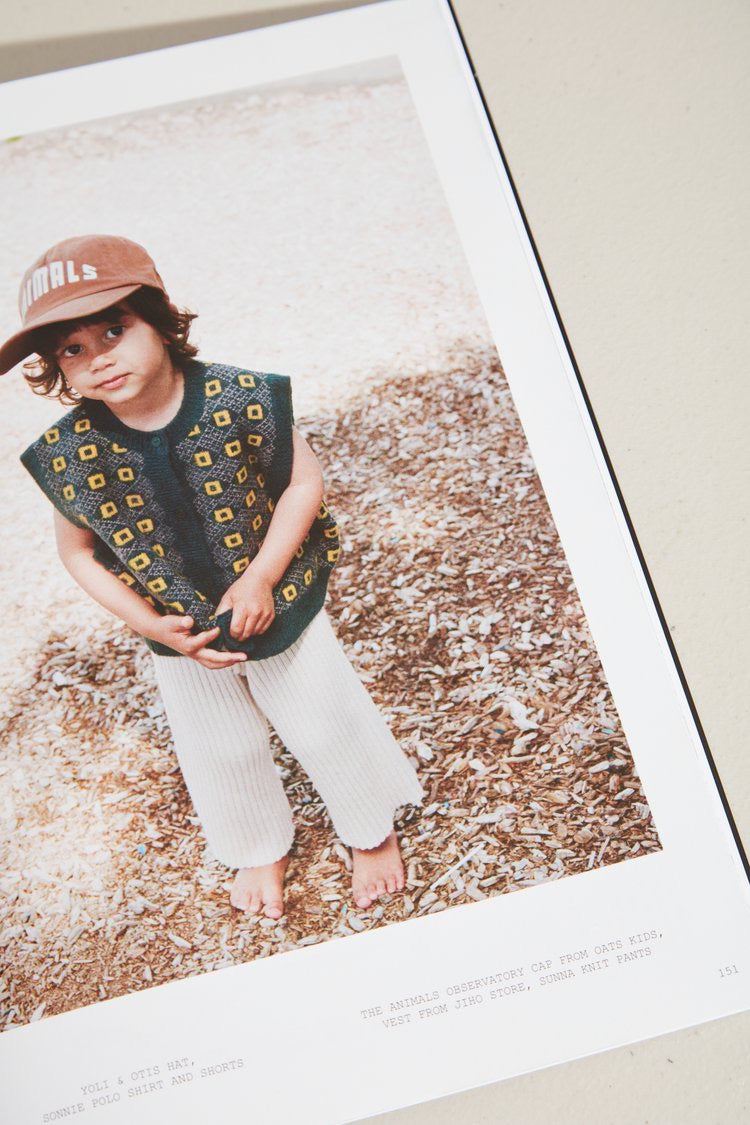 ISLAND Magazine - Issue 02 (Summer 2021/22) with a picture of a child wearing a hat.