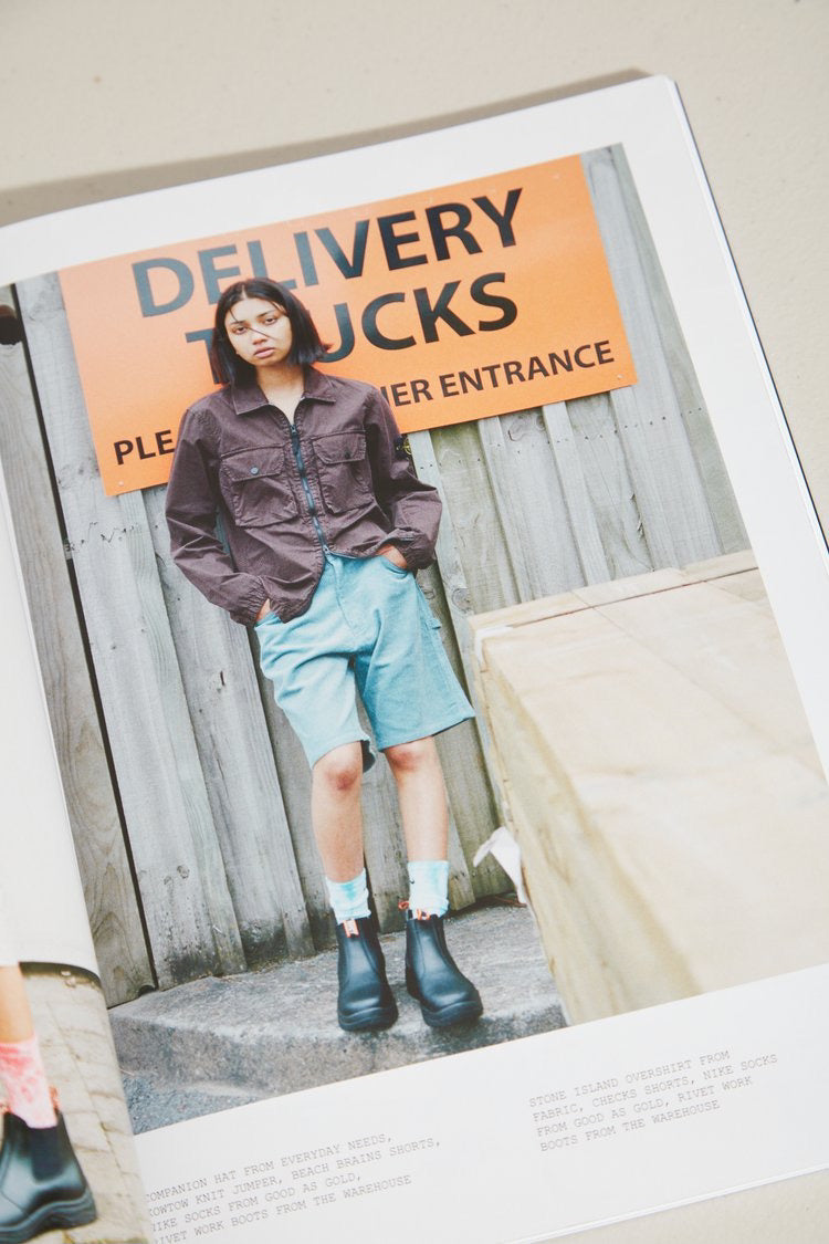ISLAND Magazine – Issue 02 (Summer 2021/22), a magazine with a picture of a woman standing next to a delivery truck.