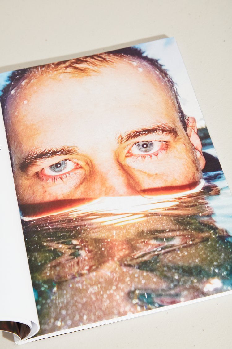 ISLAND Magazine - Issue 02 (Summer 2021/22) by ISLAND Magazine is a book with a man&#39;s face in the water.