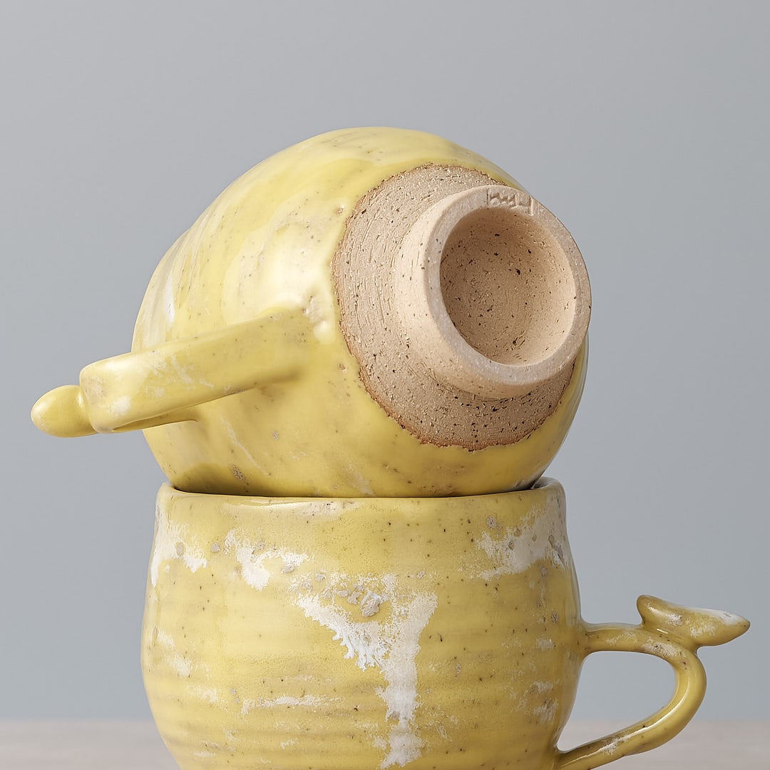 Handmade Bird Handle Cup - Citrus mugs stacked on top of each other from Jino Ceramic Studio.