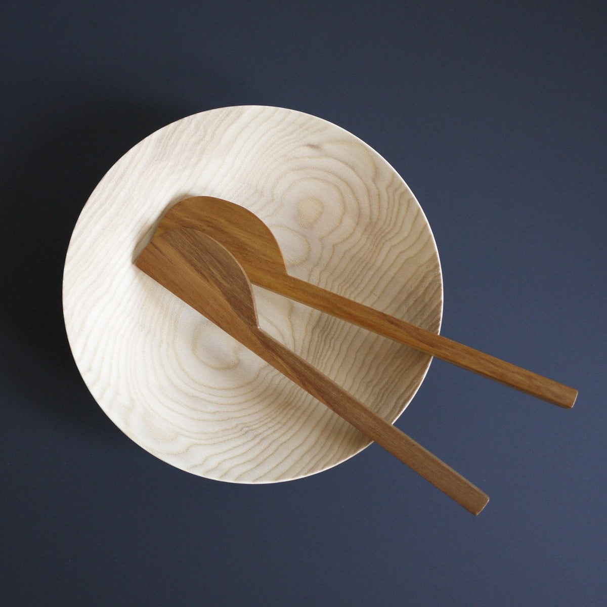 Two Kihachi wooden spoons in a Kihachi wooden bowl.