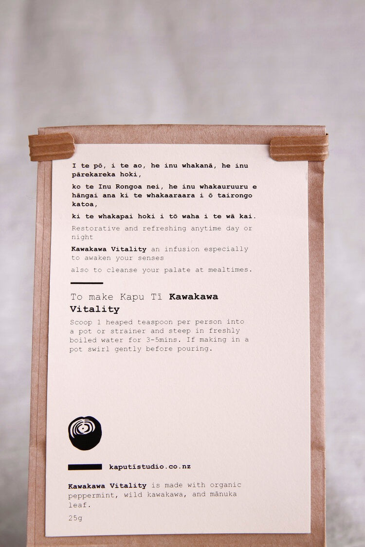 A Kawakawa Vitality brown paper bag with a note on it from Kaputi Studio.