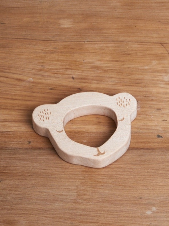 A Koala Bear Teether by Wooden Story on a wooden table.