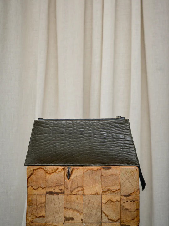 A small wooden Maya Clutch – Moss with a black and grey crocodile print from Kohl & Co.