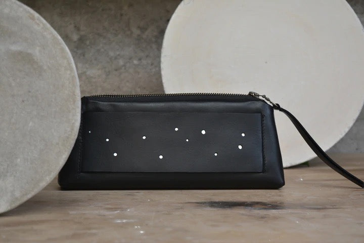 A black Space Dust Wallet with stars on it by Kohl &amp; Co.