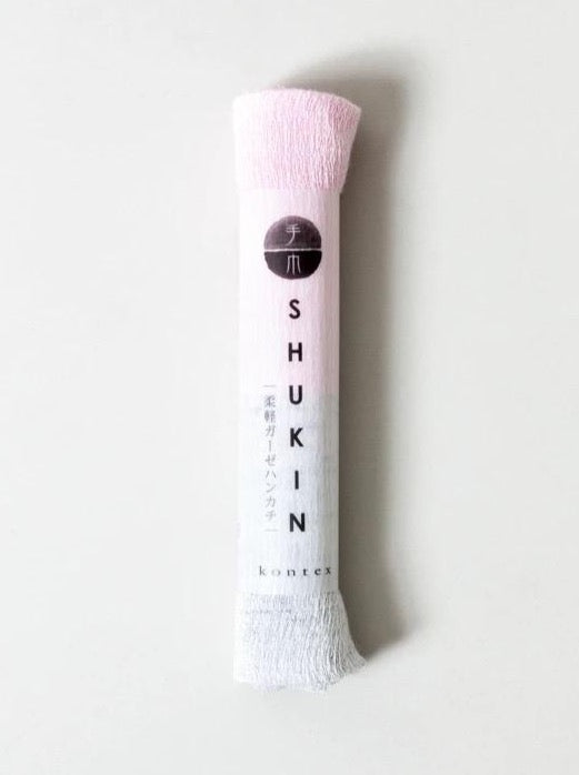 A highly absorbent Japanese-designed Kontex Shukin Towel – Two Tone Grey ⋄ Pink with packaging, made in Imabari.
