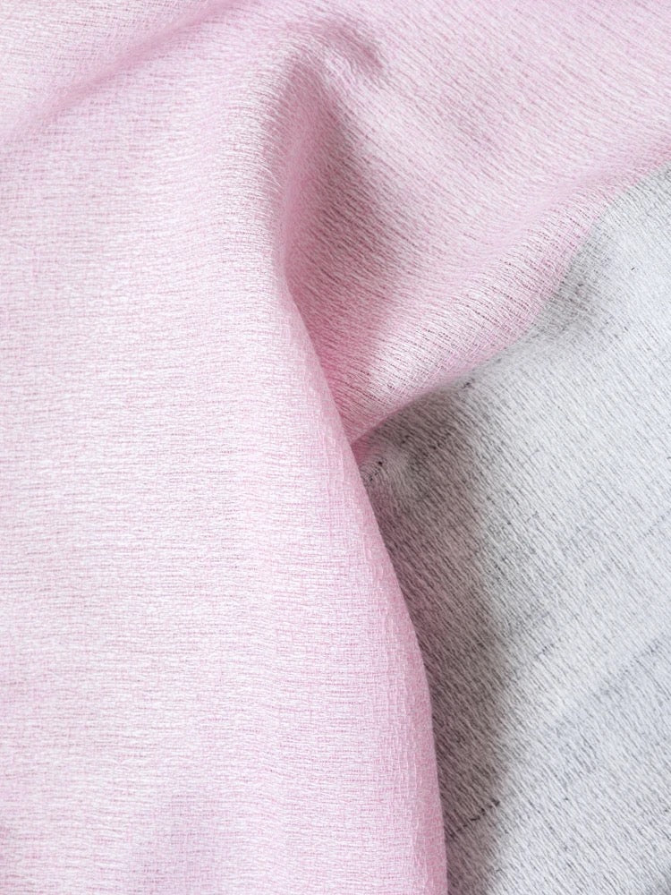 Close-up of highly absorbent pink and gray textured Kontex Shukin Towel – Two Tone Grey ⋄ Pink with soft folds, made in Imabari.
