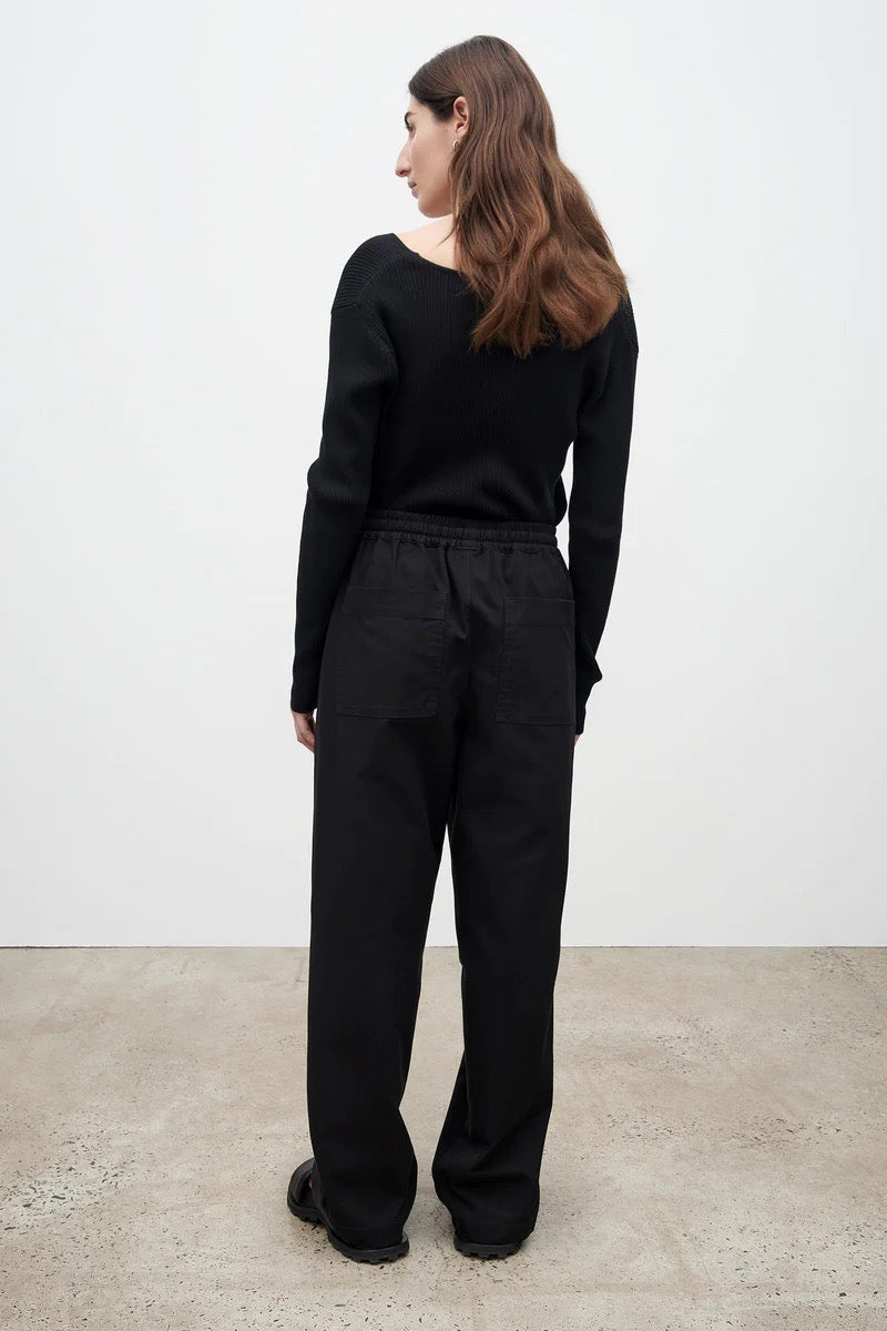 The back view of a woman wearing Kowtow&#39;s Blake Pants - Black trousers.