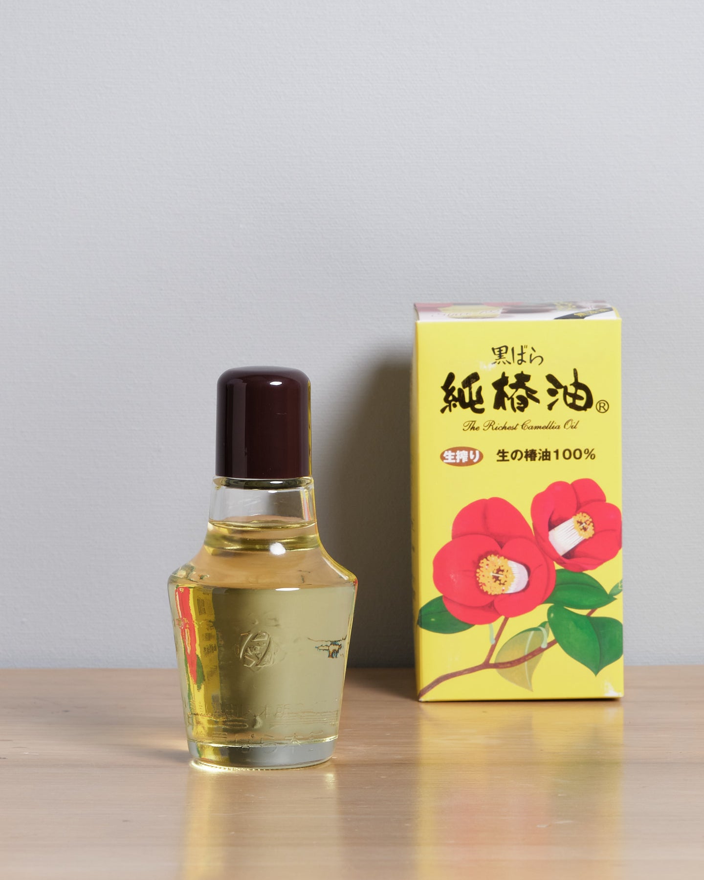 A bottle of Kurobara Camellia Oil for Carbon Steel Knives & Tools next to a box.
