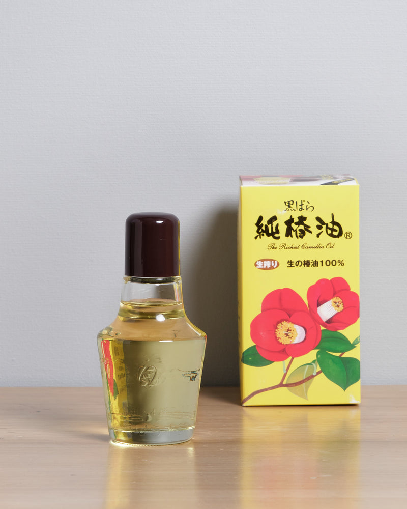 A bottle of Kurobara Camellia Oil for Carbon Steel Knives & Tools next to a box.