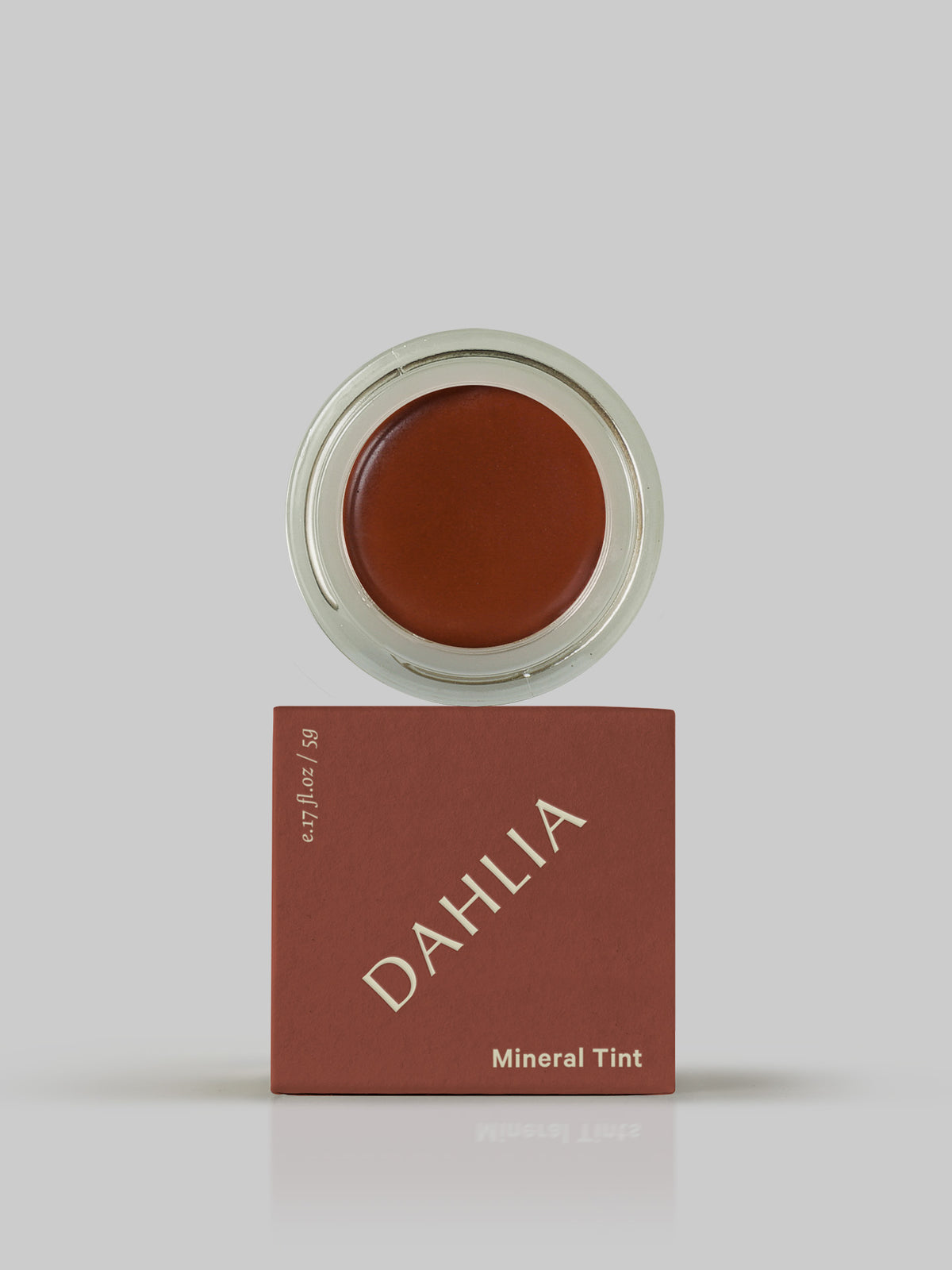 MARYSE&#39;s Dahlia mineral tint in a box on a grey background.
