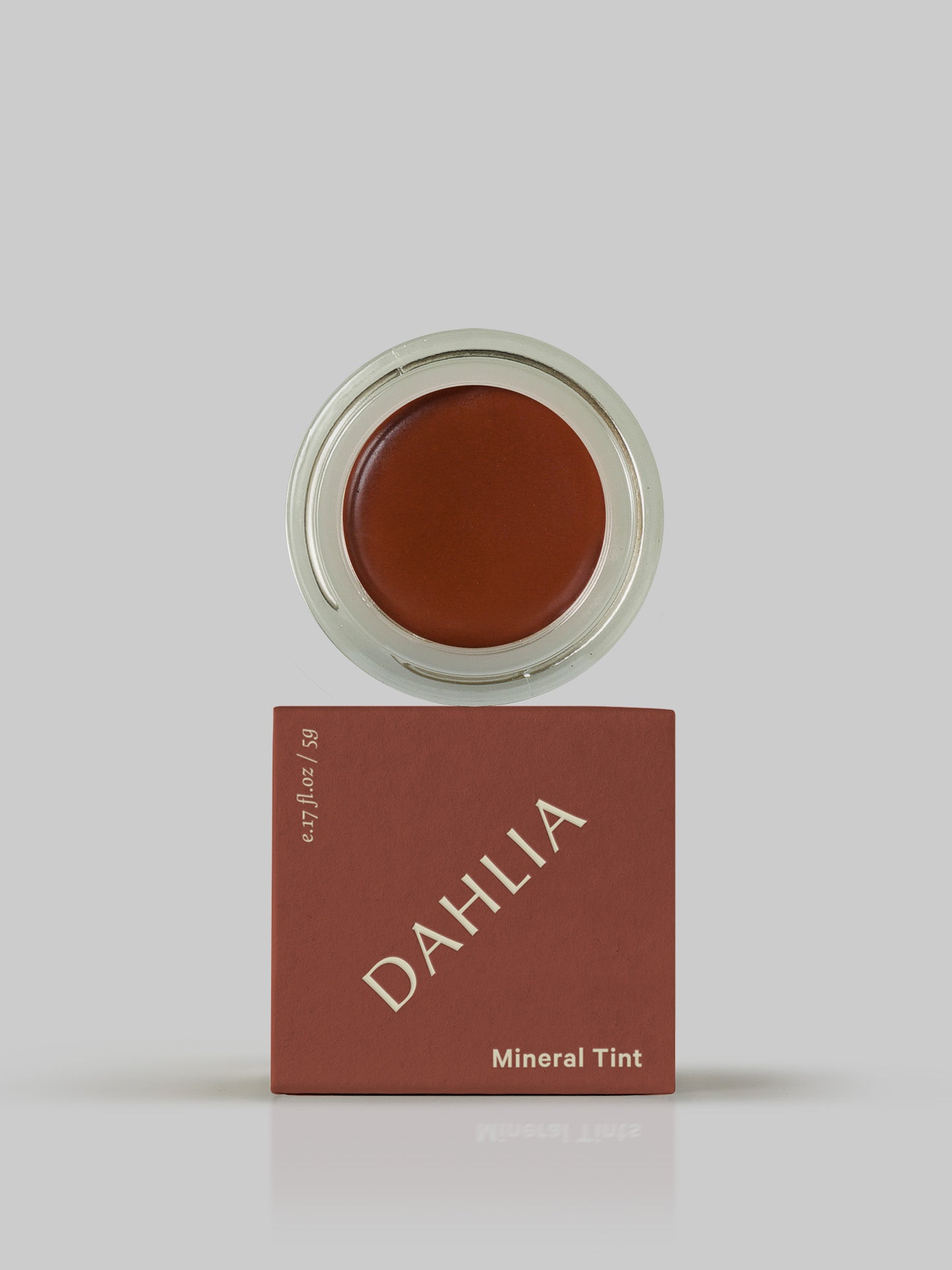MARYSE's Dahlia mineral tint in a box on a grey background.