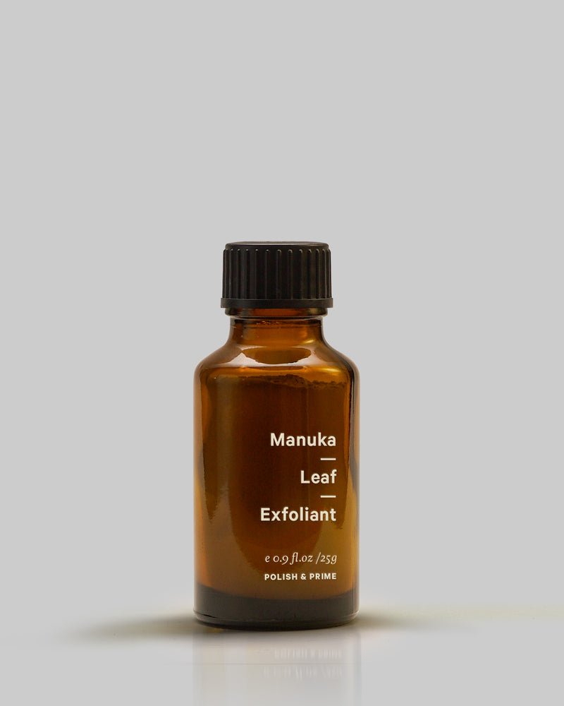 A bottle of Manuka Leaf – Exfoliant by MARYSE on a grey background.
