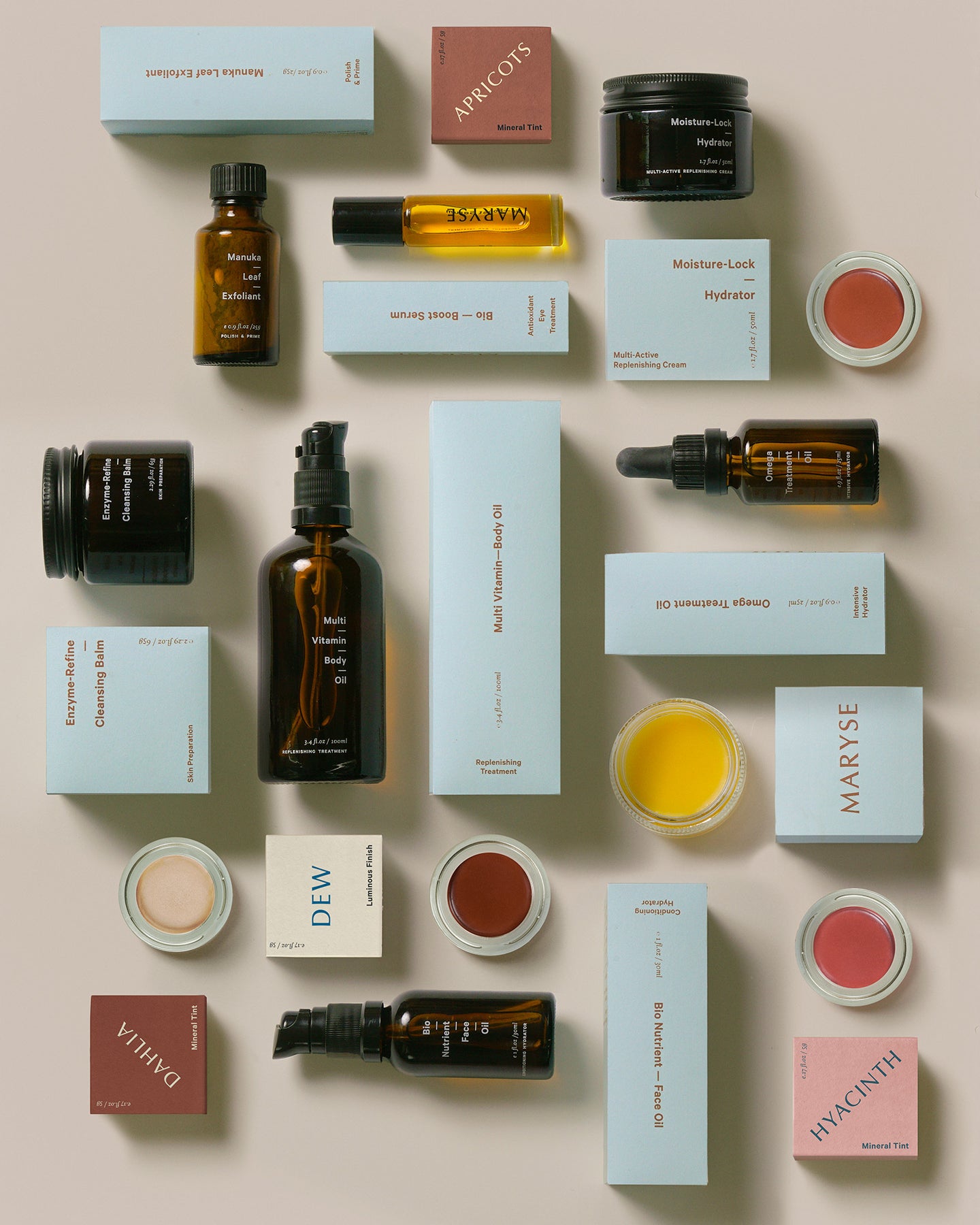 A bottle of MARYSE Omega – Treatment Oil on a grey background.