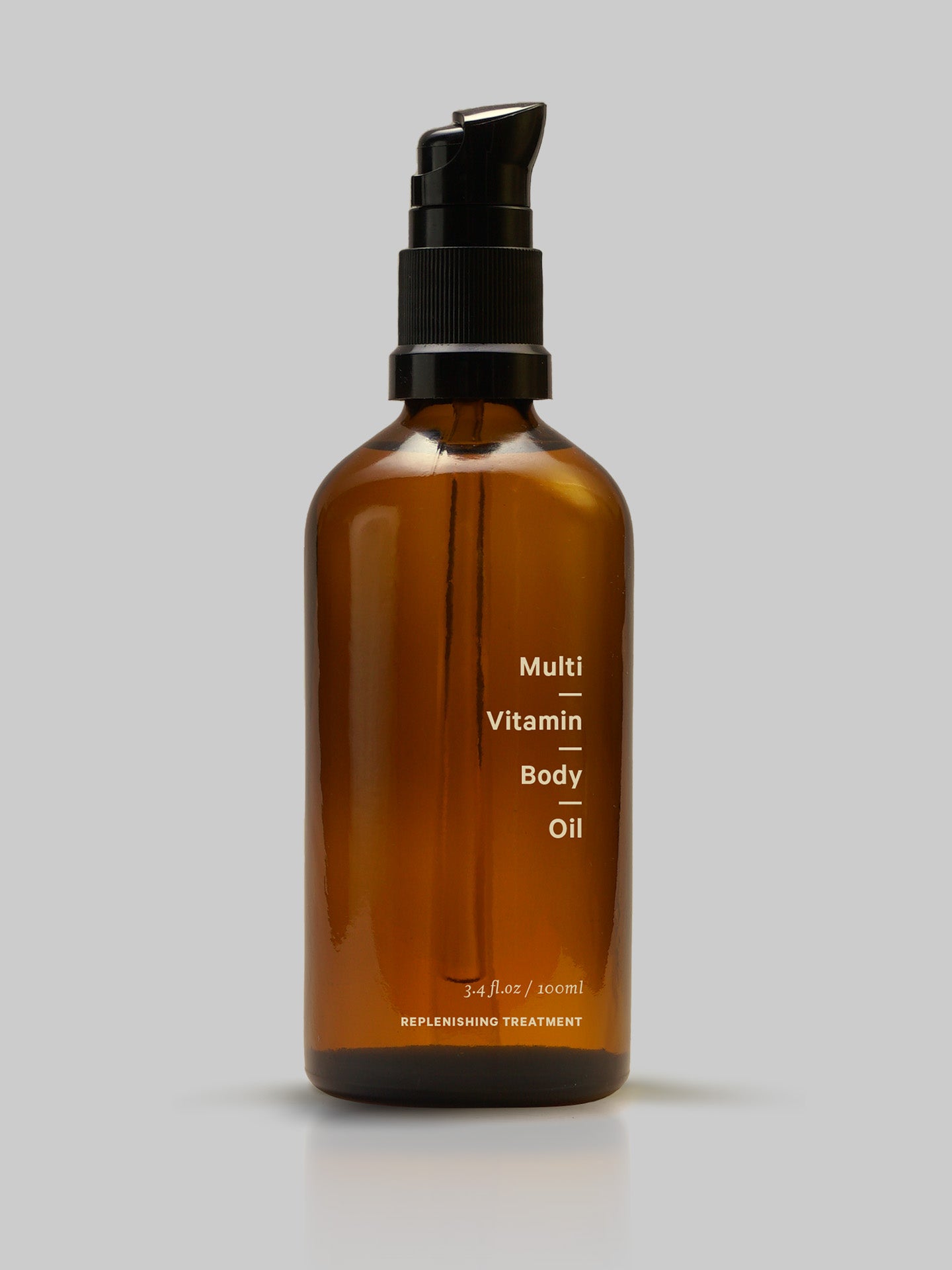 A bottle of MARYSE Multi-Vitamin – Body Oil on a gray background.