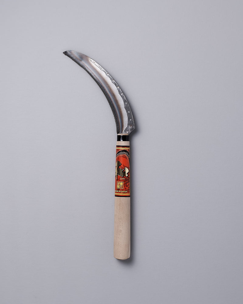 A Flax Cutter with a wooden handle on a gray background. (Maruyoshi)