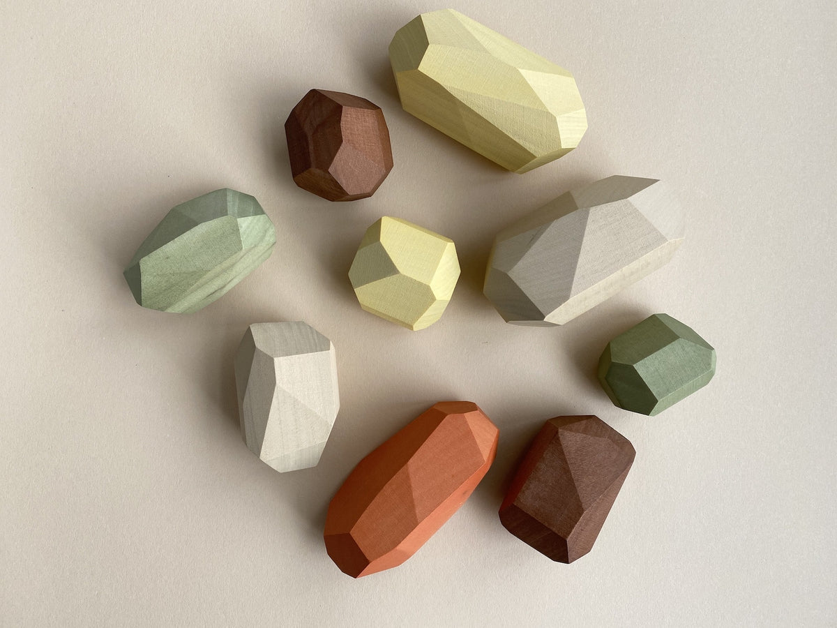 A group of Balancing Stones - Earthy arranged on a white surface by MinMin Copenhagen.