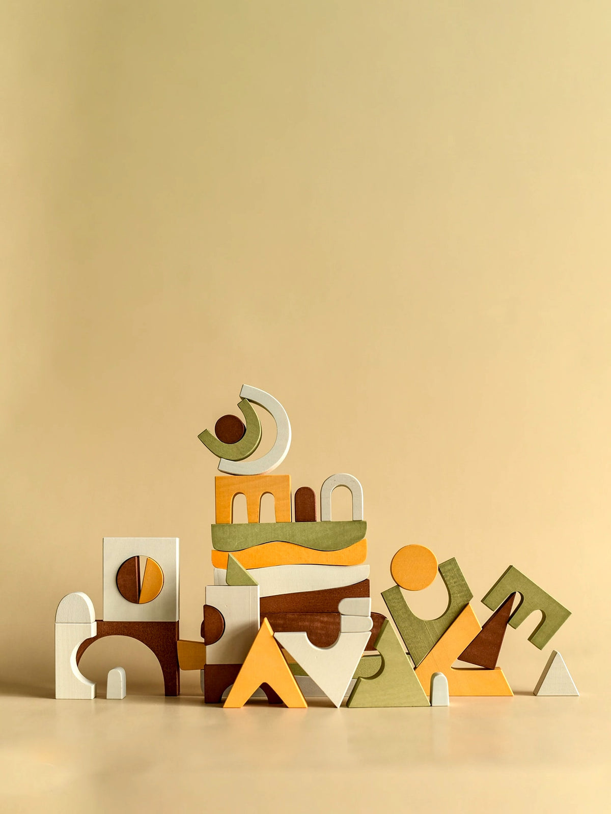 A stack of MinMin Copenhagen Puzzle Game wooden blocks on a beige background.