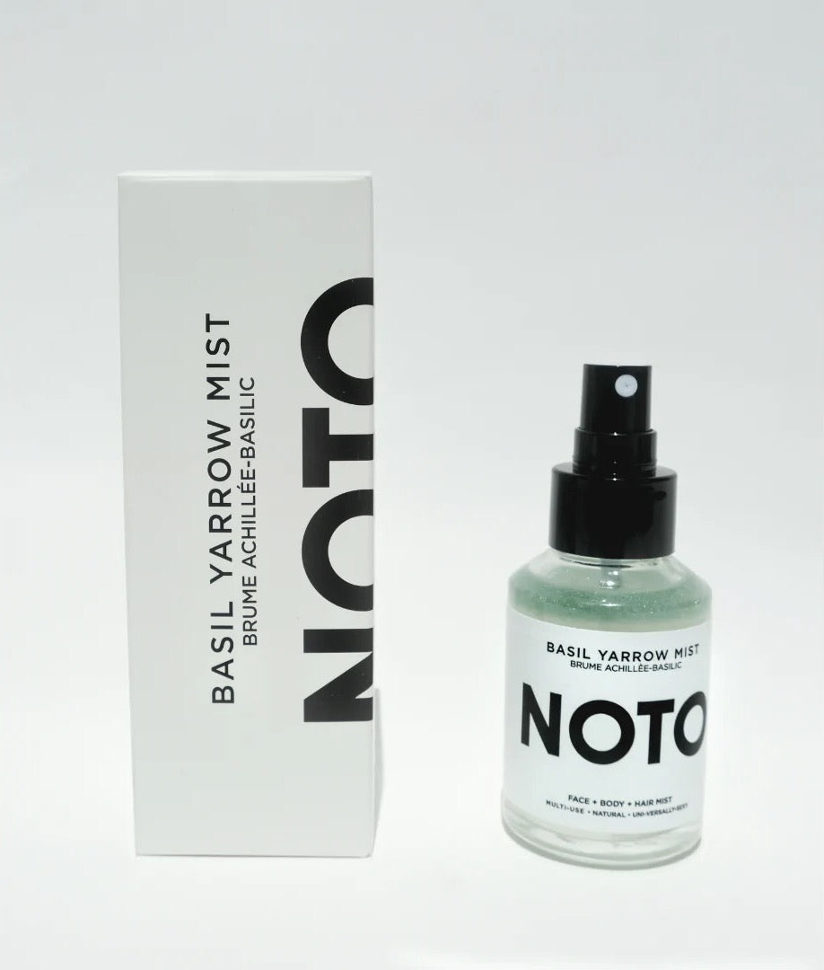 A bottle of NOTO Basil Yarrow Mist with a box next to it.