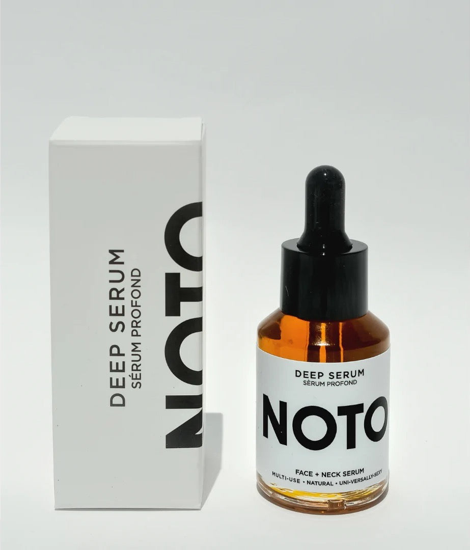 A bottle of Mini Deep Serum by NOTO next to a box.