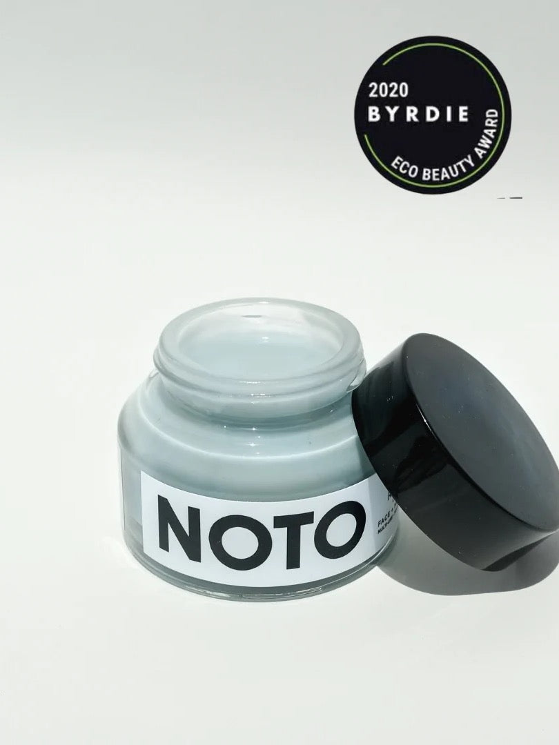 A jar of NOTO Moisture Riser Cream on a white surface.