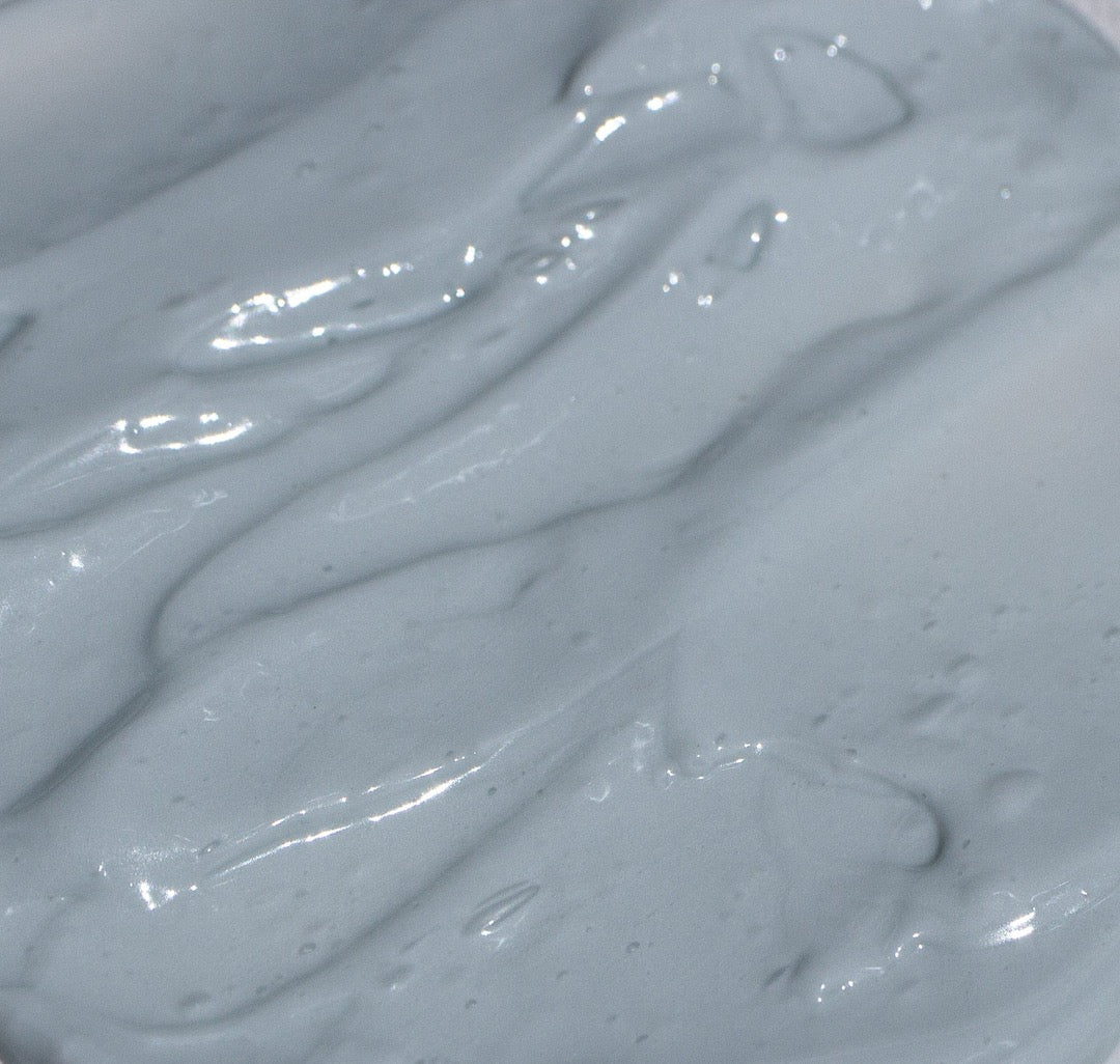 A close up of NOTO&#39;s Moisture Riser Cream, a blue liquid.