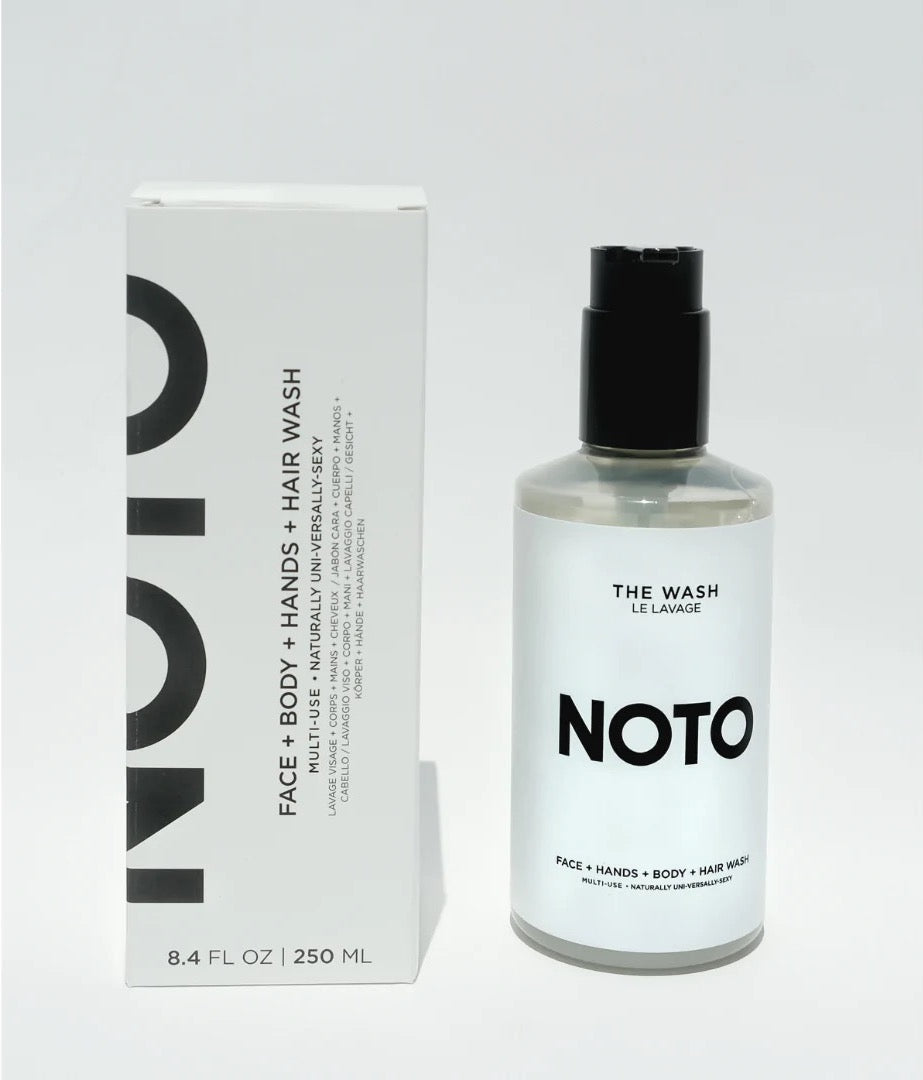 A bottle of NOTO hand wash called The Wash next to a box.