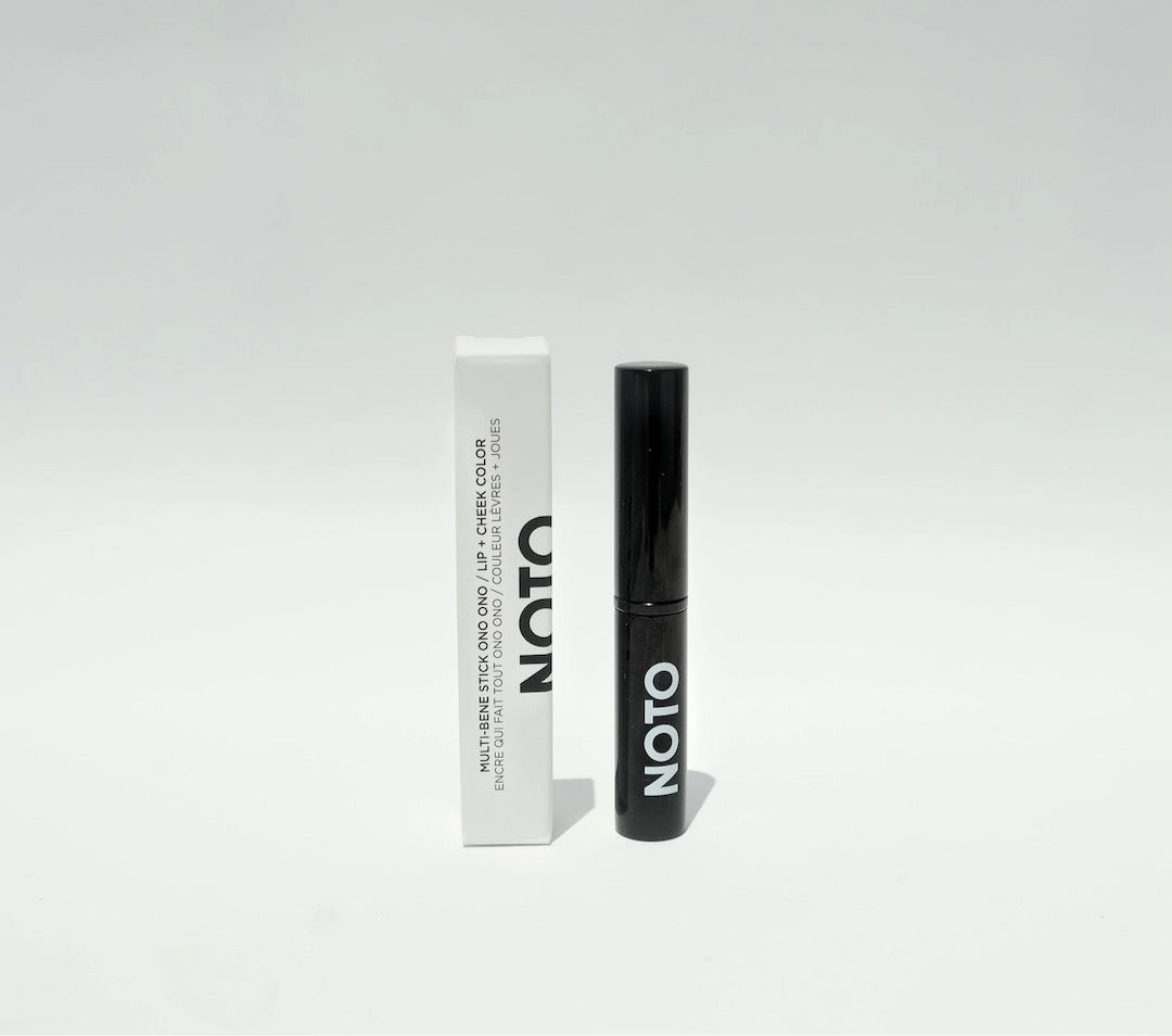 A black tube of NOTO&#39;s Ono Ono – Multi-Bene Stain Stick // Lips + Cheeks on a white background.
